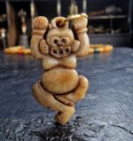 Hand-carved Kapala ritual amulet with traditional skull motifs.