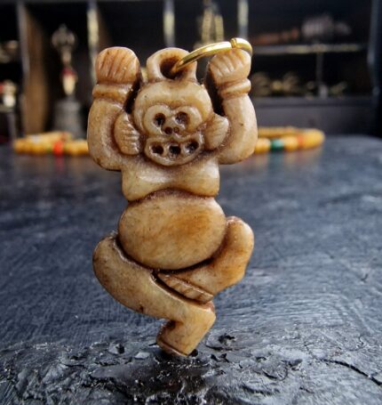 Hand-carved Kapala ritual amulet with traditional skull motifs.