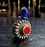Hand-crafted silver ritual bead with traditional filigree.
