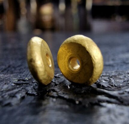 Hand-crafted 18c solid gold bead with a rich luster.
