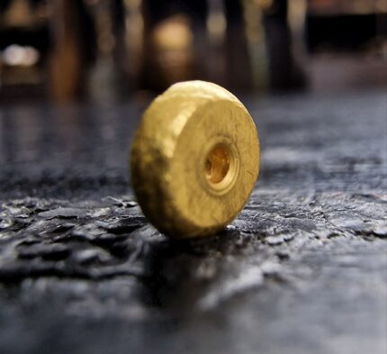 Hand-crafted 18c solid gold bead with a rich luster.