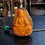 Hand-crafted Budha ritual amulet with an authentic aged patina.