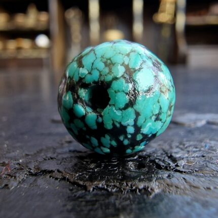 Hand-selected Tibetan turquoise with a natural dark matrix.