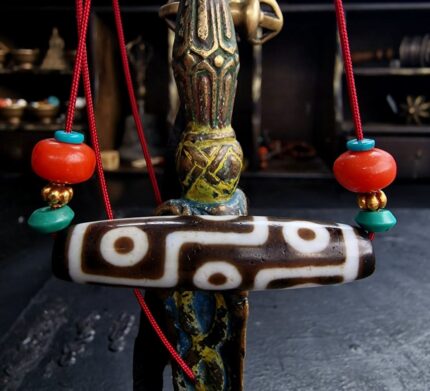 Hand-etched 9 eye Dzi bead with authentic weathered agate.