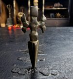 Hand-cast Tibetan Phurba dagger with traditional triple-faced deity.