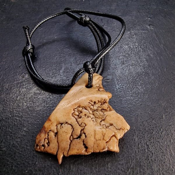 Kapala Amulet full view on string