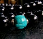 Antique Tibetan turquoise bead with gold spacers detail