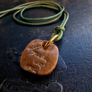 Kapala Amulet full view on leather