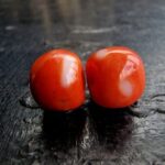 Natural momo coral bead with turquoise spacers close-up