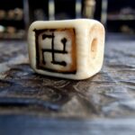 19th century ivo dice amulet close-up