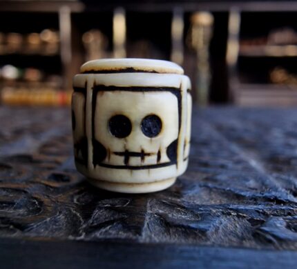 Hand-carved bone skull bead with an authentic ritual patina.