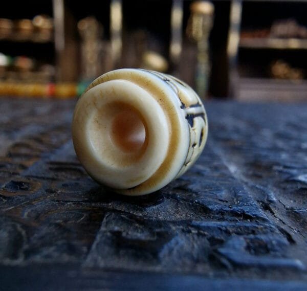 Antique ivory skull bead hole view