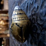 Tibetan stupa amulet with consecrated silver cover