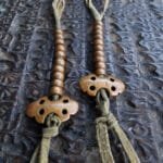 Tibetan copper mala counters close-up