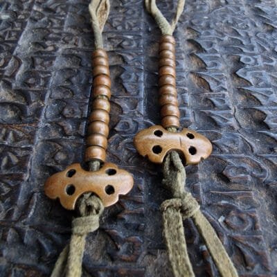Tibetan copper mala counters close-up
