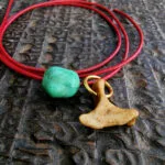 Tibetan turquoise and kapala skull bone amulet close-up