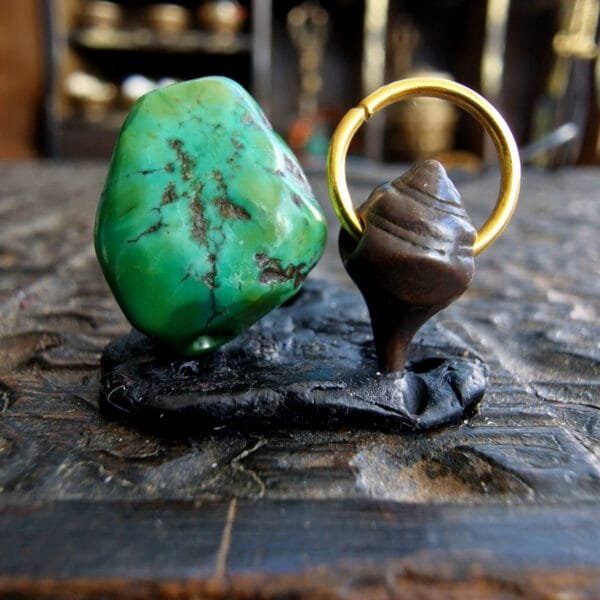 500-year-old turquoise amulet with black leather cord