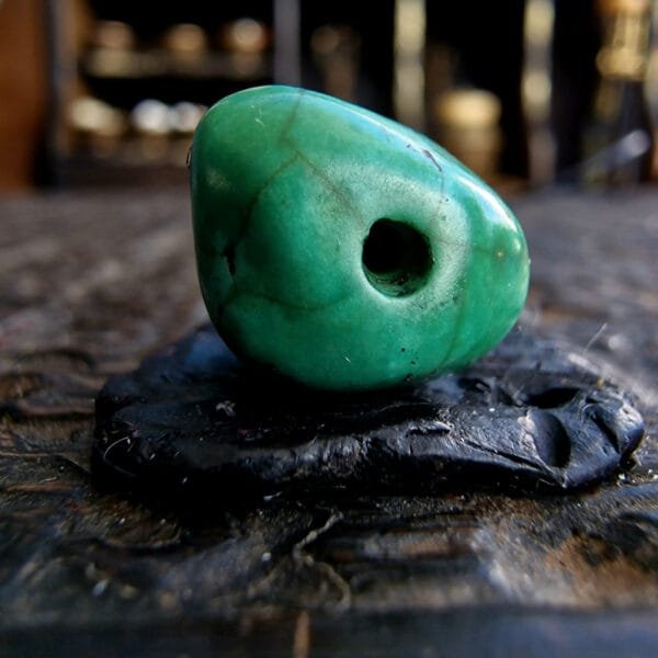 Tibetan turquoise skull bone amulet close-up