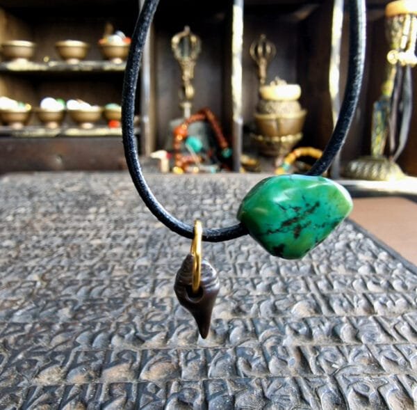 Ancient turquoise and copper alloy thogchag spiritual amulet