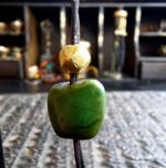 Tibetan turquoise bead with gold wax and patina detail