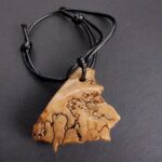 Kapala Amulet full view on string