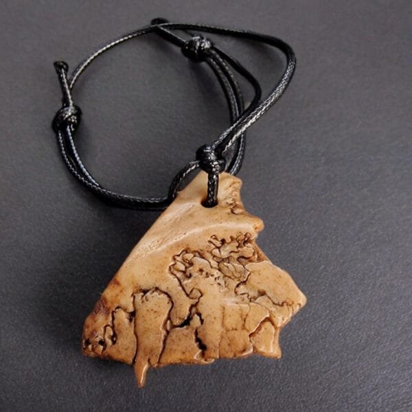 Kapala Amulet full view on string