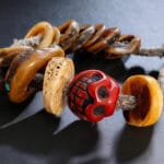 Detailed view of antique Kapala prayer beads on wrist