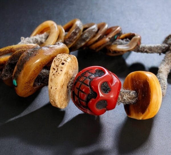 Detailed view of antique Kapala prayer beads on wrist