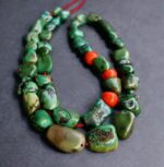 Hand-carved ancient Tibetan ritual bead with weathered patina.