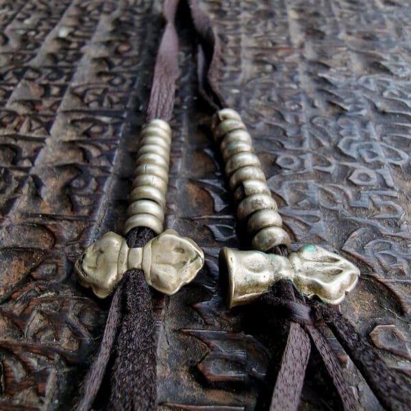 Monk-owned antique mala counters with patina