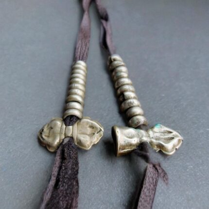 Antique Tibetan white copper mala counters close-up