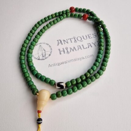 Hand-strung 108 turquoise prayer beads featuring a central etched Dzi bead and resin Guru.