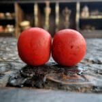 Authentic Sherpa coral beads featuring a rich red hue and natural weathered texture.