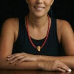 Hand-strung Sherpa coral mala featuring deep red beads and traditional ritual spacing.