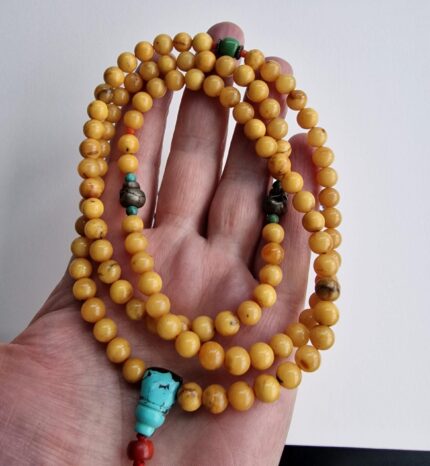 Hand-strung Baltic amber prayer beads featuring warm honey tones and natural inclusions.