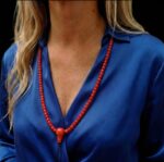 Hand-strung red coral mala necklace featuring 108 vibrant Mediterranean coral beads for ritual use.