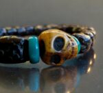 Hand-strung Rudraksha beads bracelet with a central hand-carved bone Kapala skull.