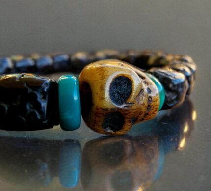Hand-strung Rudraksha beads bracelet with a central hand-carved bone Kapala skull.