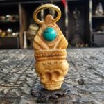 Hand-carved Tibetan bone carving of a Chittipati skull with a deep, aged ritual patina.