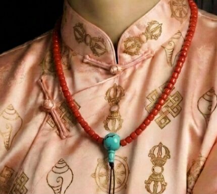 Hand-polished 6mm red coral prayer beads with a natural turquoise guru bead.