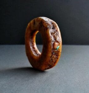 Hand-carved antique Tibetan kapala skull amulet centerpiece on a weathered 108 Bodhi seed prayer mala.