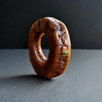 Hand-carved antique Tibetan kapala skull amulet centerpiece on a weathered 108 Bodhi seed prayer mala.