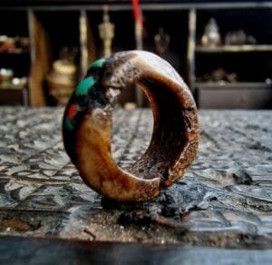 Hand-carved antique Tibetan kapala skull amulet