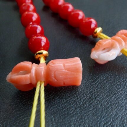 Hand-selected coral counter beads with a rich red hue.
