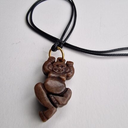 Hand-carved antique Tibetan kapala skull amulet centerpiece on a weathered 108 Bodhi seed prayer mala.