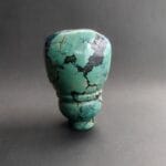 Hand-carved Tibetan turquoise guru bead with a natural matrix.