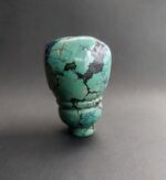 Hand-carved Tibetan turquoise guru bead with a natural matrix.