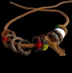 Hand-carved Kapala bone skull beads on a ritual protection bracelet.