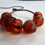 Hand-polished 11g antique Tibetan amber bracelet featuring a deep honey patina and natural organic inclusions.
