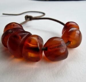Hand-polished 11g antique Tibetan amber bracelet featuring a deep honey patina and natural organic inclusions.